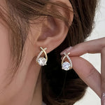 Soledad - Earrings with gold cross and zircon