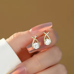 Soledad - Earrings with gold cross and zircon