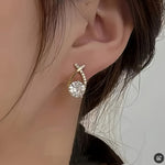 Soledad - Earrings with gold cross and zircon