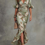 Anne | Long, asymmetrical green satin dress with a V-neck, puff sleeves, and a floral print